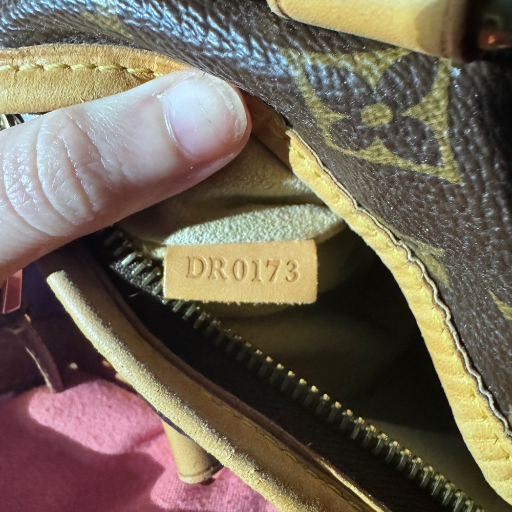 Authentic (without papers) LV. Worn in, but in good condition